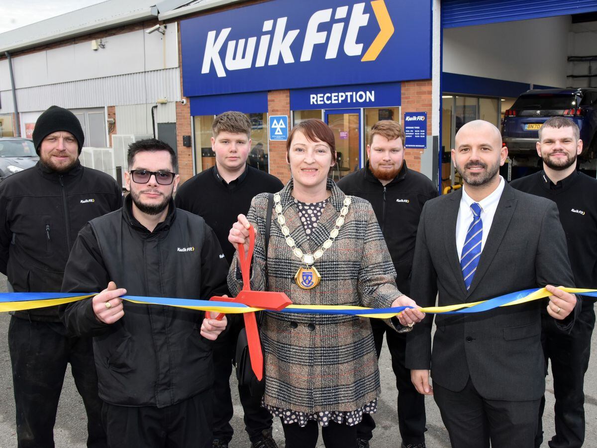 Shrewsbury deputy mayor Cllr Becky Wall with manager Aidan Catterson, operations manager Mike Ellis, and the Kwik Fit team