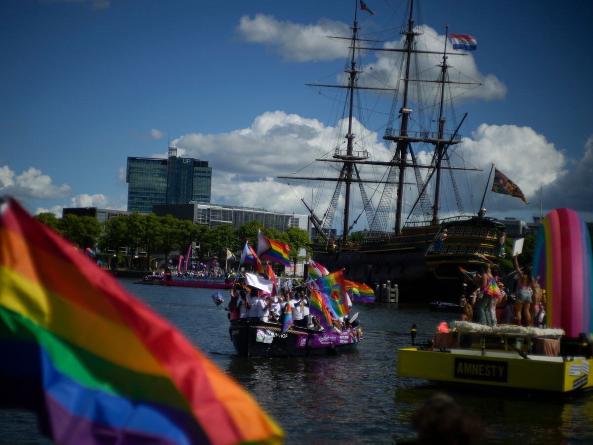 Boats line up for the start as thousands of people lined canals in the Dutch capital to watch the colourful spectacle of the Pride Canal Parade in Amsterdam, Netherlands