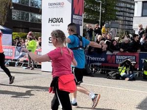 Rich Turner crossing the line in the Manchester Marathon
