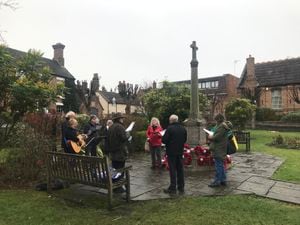 Broseley Churches Together singing Christmas carols in Broseley Memorial Garden on Saturday