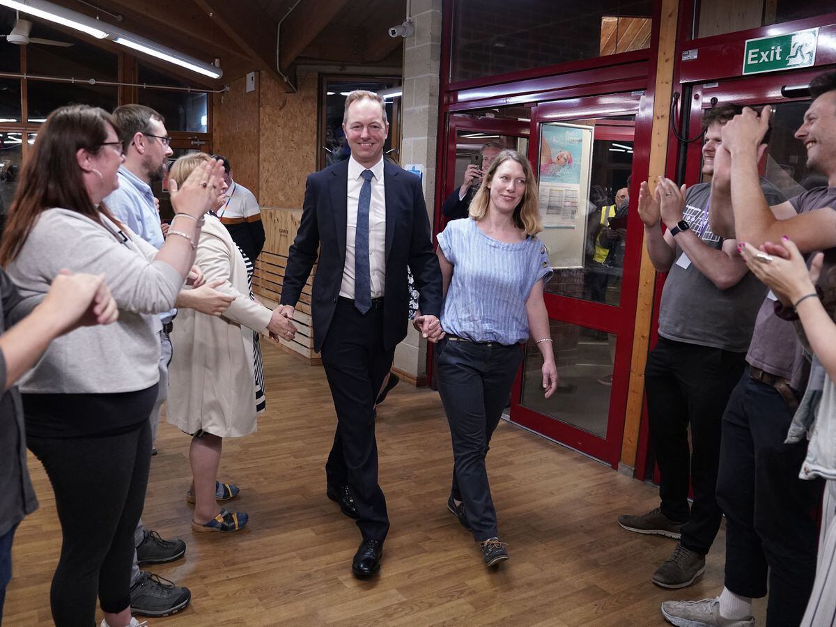 The Liberal Democratsâ by-election candidate Richard Foord and his wife Kate are greeted by supporters