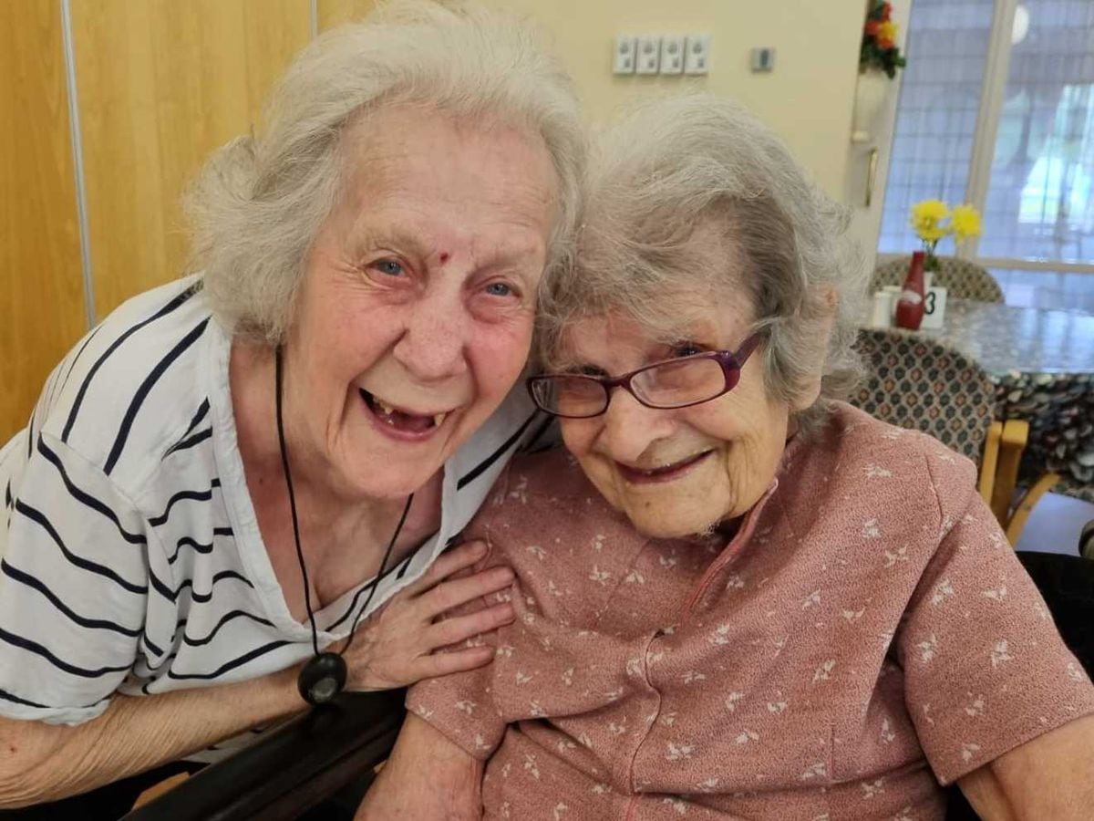 Gladys Cloke receives a birthday hug from fellow resident and friend Joan Sivill on her 110th birthday