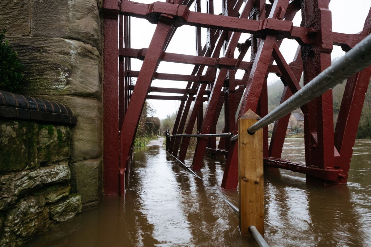 The footpath under the Iron Bridge is submerged