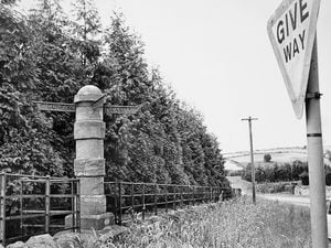 nostalgia pic. Little Brampton. A distinctive fingerpost sign on the Craven Arms to Bishop's Castle road at Little Brampton, pointing to Bishop's Castle and Clungunford and to two other places. This is a picture in the Shropshire Star picture archive. It was taken on July 24, 1987, and the photographer was Bob Craig. It has the Shropshire Star copyright stamp. It's not clear what was the reason or occasion for taking the photo of this direction pillar - can't find this pic being used in the Star in the following days. Sign. Signs. Signpost. The signpost was erected in 1800 for the Second Lord Clive and is a listed structure. Library code: Little Brampton nostalgia 2021..