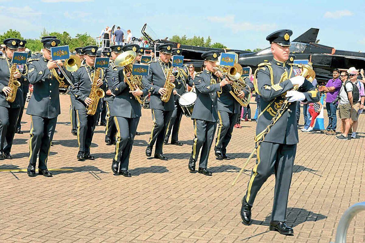 The Central Band of the Royal Air Force entertain the crowds in the sunshine at the air show