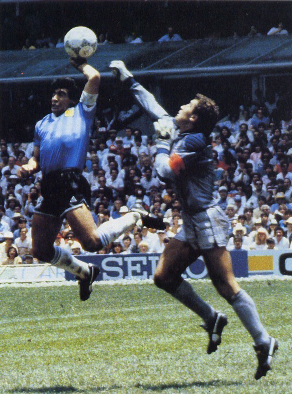 Maradona punches the goal into the net to give Argentina a 1-0 lead against England