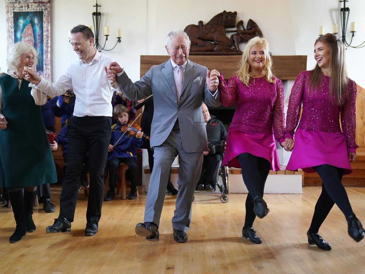 The Prince of Wales and the Duchess of Cornwall are shown the steps of a traditional Irish dance at the Bru Boru Cultural Centre in Cashel, Co Tipperary