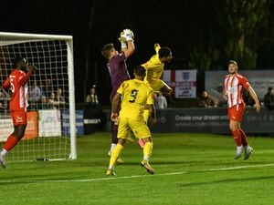 Ricardo Dinanga (AFC Telford United Midfielder) tries to get a head on the ball but Stourbridge keeper catches it.
