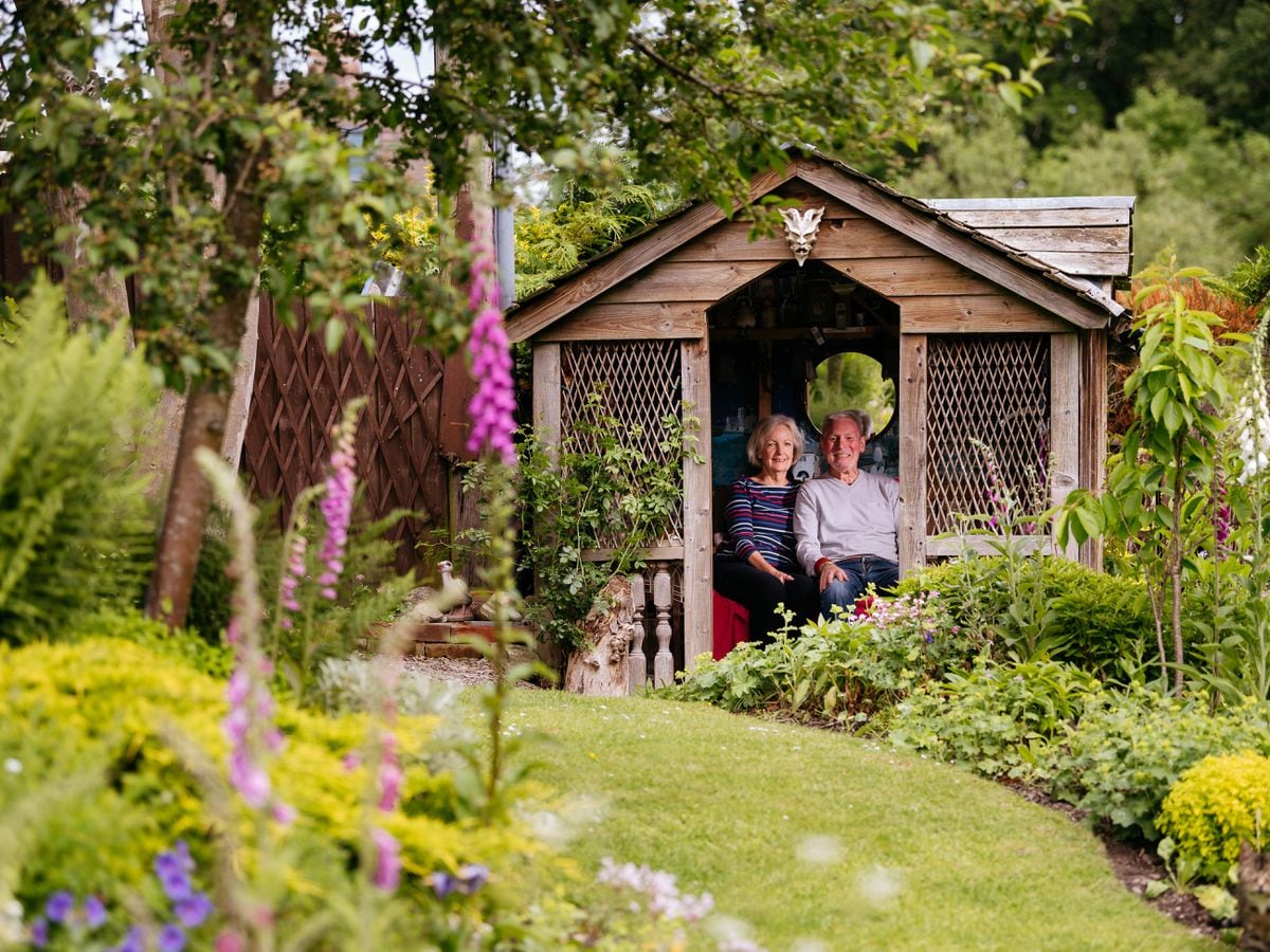 Joan and Chris Birkett in their garden in Temeside, Ludlow