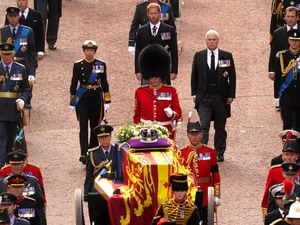 Garrison Sergeant Major Stokes and members of the Royal Family follow the coffin of Queen Elizabeth II