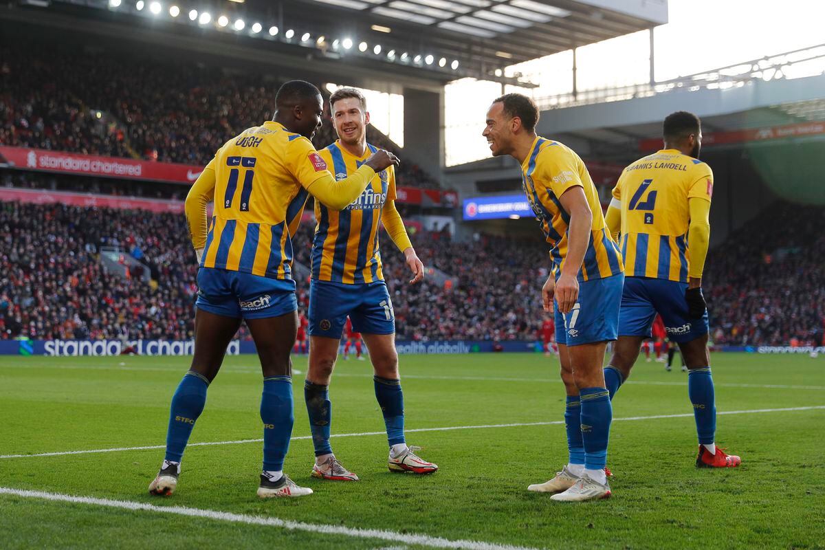 Dan Udoh of Shrewsbury Town celebrates with his team mates after scoring a goal to make it 0-1 (AMA)