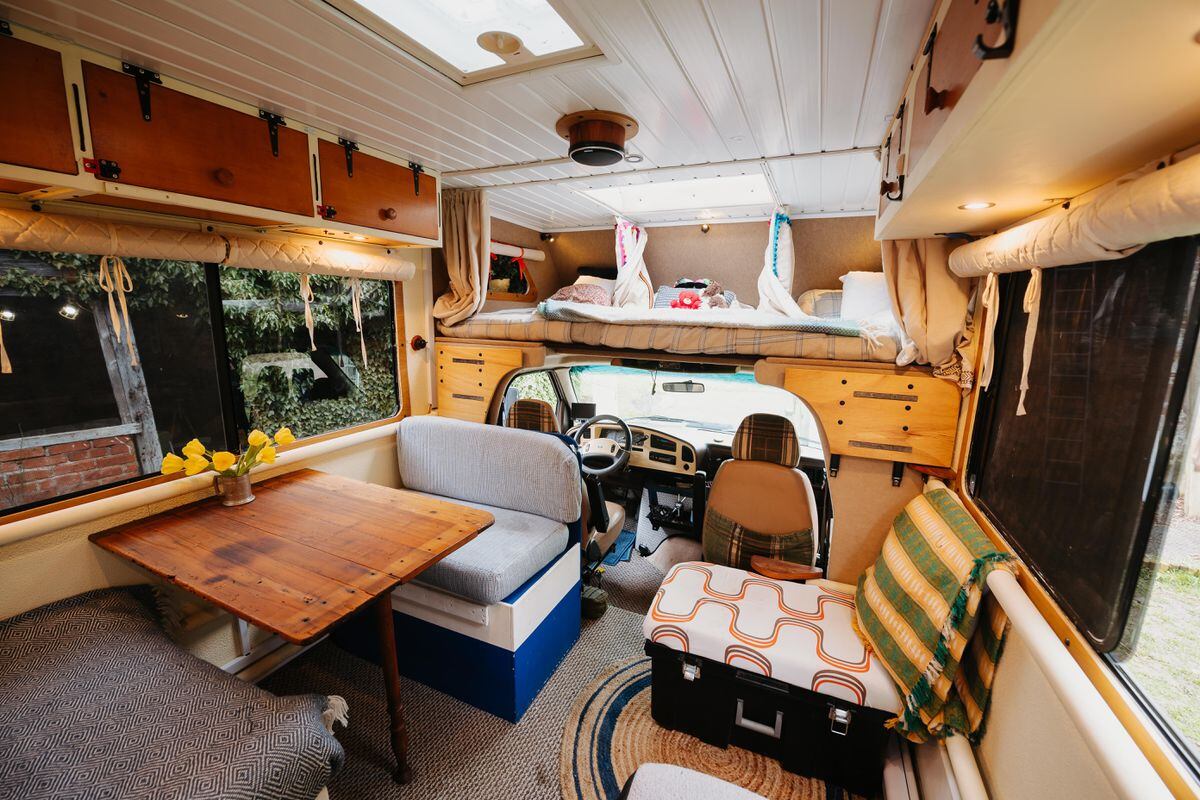 The three children have their own beds above the cab, with curtains for privacy