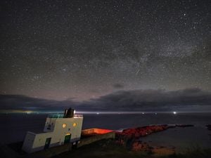 The Milky Way core rises at 3.00am over Bamburgh Lighthouse in Northumberland on the North Eastâ¦