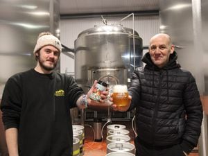 Head Brewer Cody Palin and MD Gary Walters In front of the new keg system with a craft beer release from Derailed by Ludlow Brewery from last year, Jam Dunk.