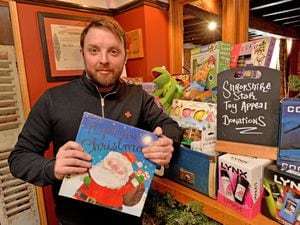 Red Lion manager Oli Young with some of the gifts donated to the Shropshire Star Christmas Toy Appeal