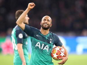 Tottenham Hotspur’s Lucas Moura celebrates with the match ball after scoring a hat-trick
