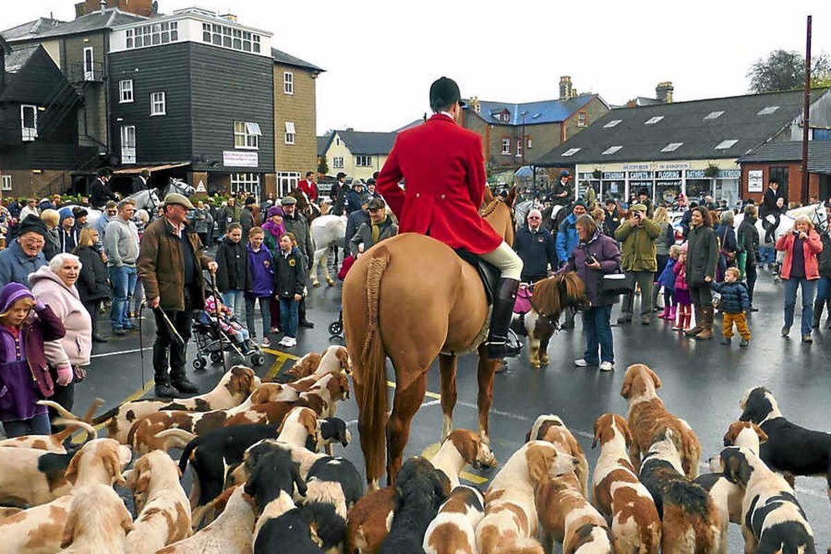 Crowds of onlookers gather to watch members of the Teme Valley Hunt gather for the Boxing Day meet at Knighton