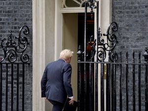 Boris Johnson returns inside to No 10 following his resignation speech
