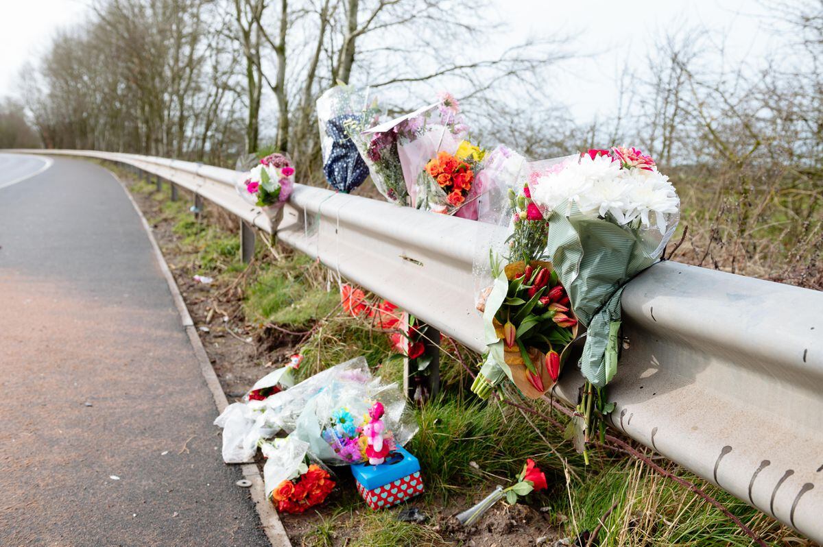 Flowers left at the scene of Saturday's crash