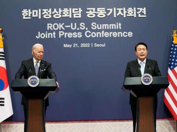 US President Joe Biden listens to South Korean President Yoon Suk Yeol speak during a news conference at the Peopleâs House inside the Ministry of National Defence in Seoul