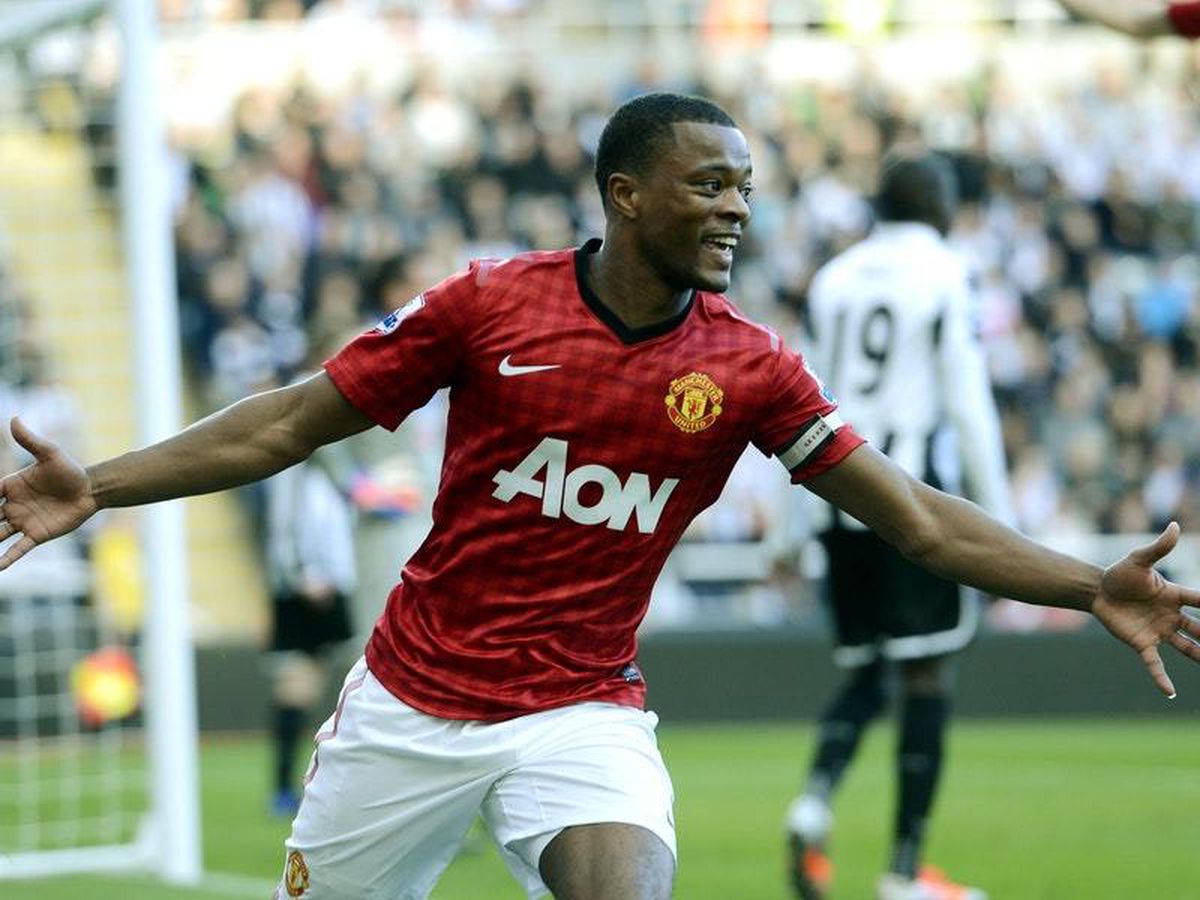 Manchester United's Patrice Evra celebrates while playing for Manchester United