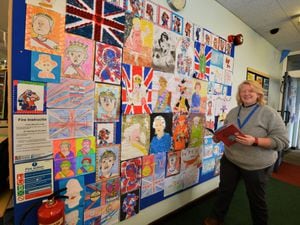 Branch manager Michelle Szulc with a display of pictures ready for Jubilee celebrations at Market Drayton Library