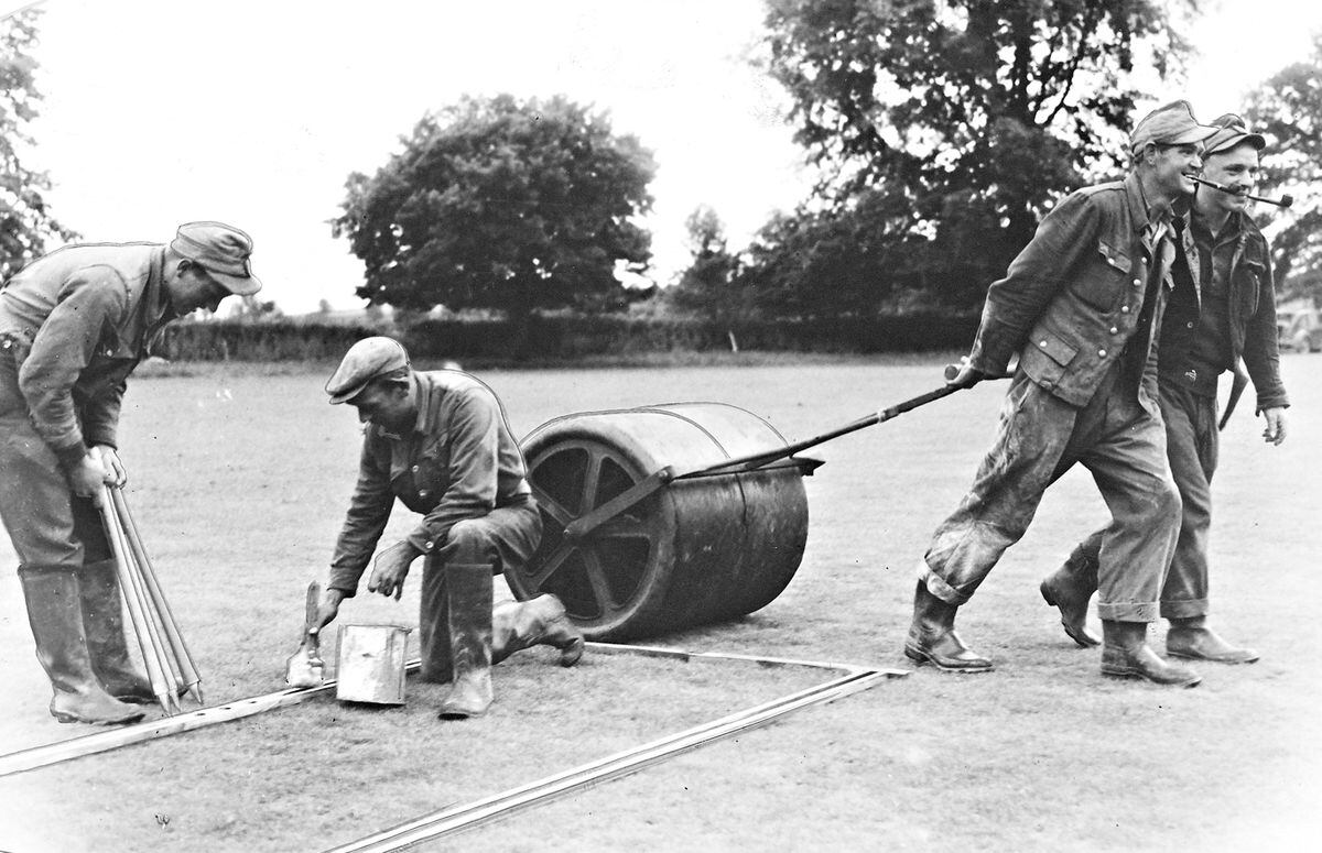 Prisoners prepare the wicket at Claverley in July 1947.