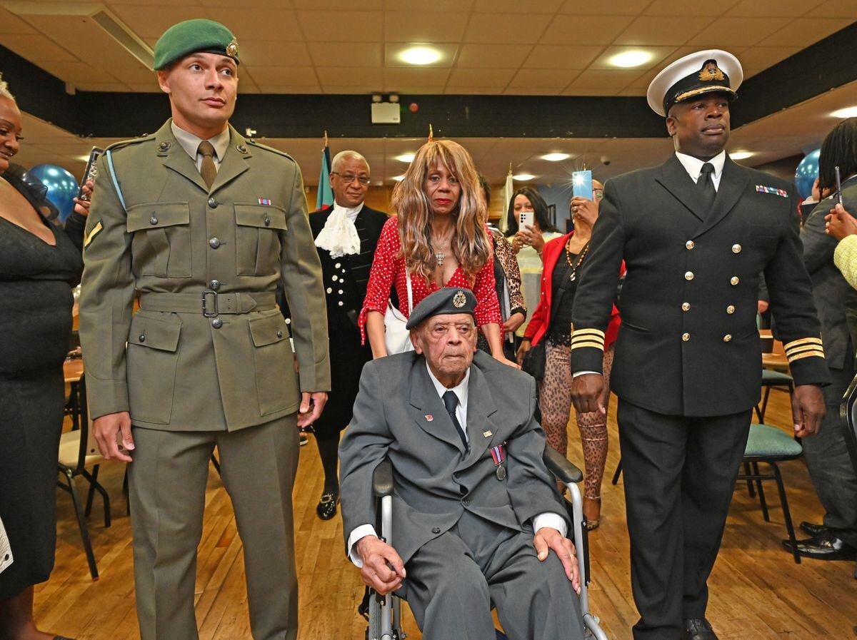 Officers from RAF Cosford forming a guard of honour for RAF veteran Ernest Nicholas at the Gornal British Legion, Dudley 