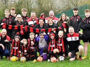 Members of AFC Bridgnorth Spartans pictured with Chairman Hartmut Siegl (centre) in April