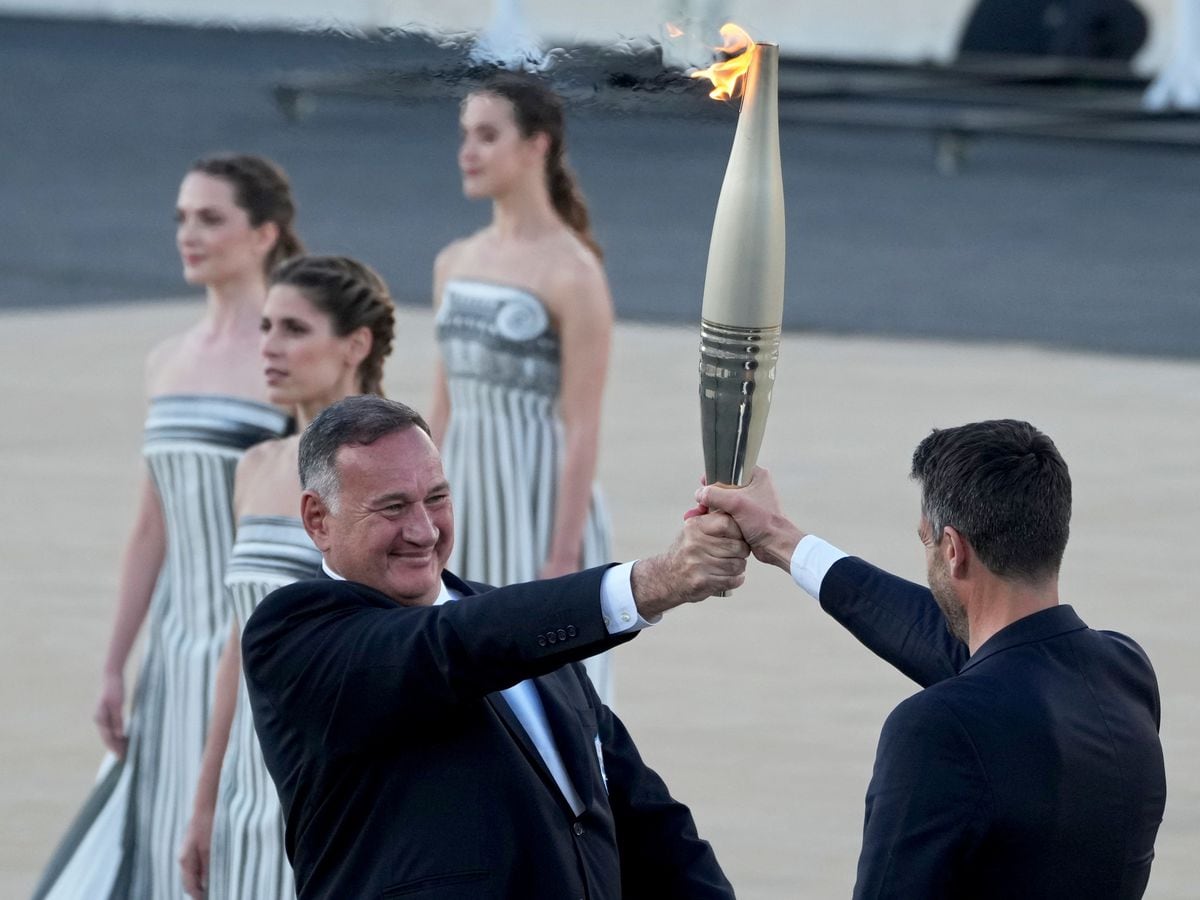 Paris organisers receive Olympic flame at Greek venue of first modern Games