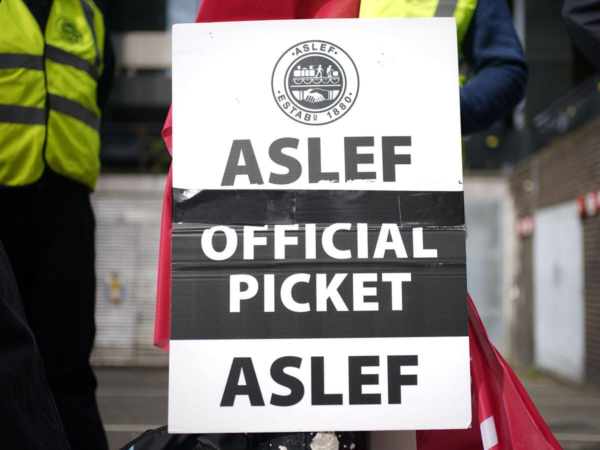 Members of the drivers’ union Aslef on the picket line at Euston station (Yui Mok/PA)