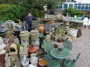 Tim Dams with some of the architectural and garden items at Corner Farm Antiques