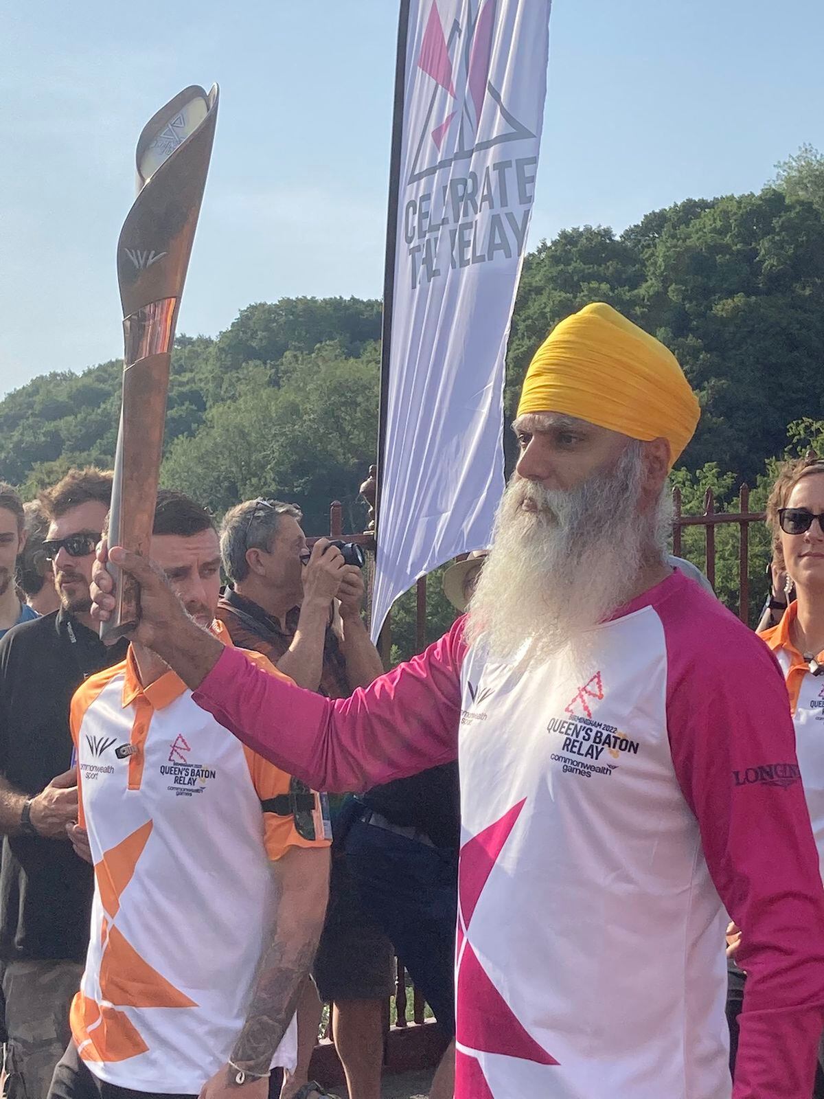 Dementia ambassador and Wolves fan Many Kang with the baton