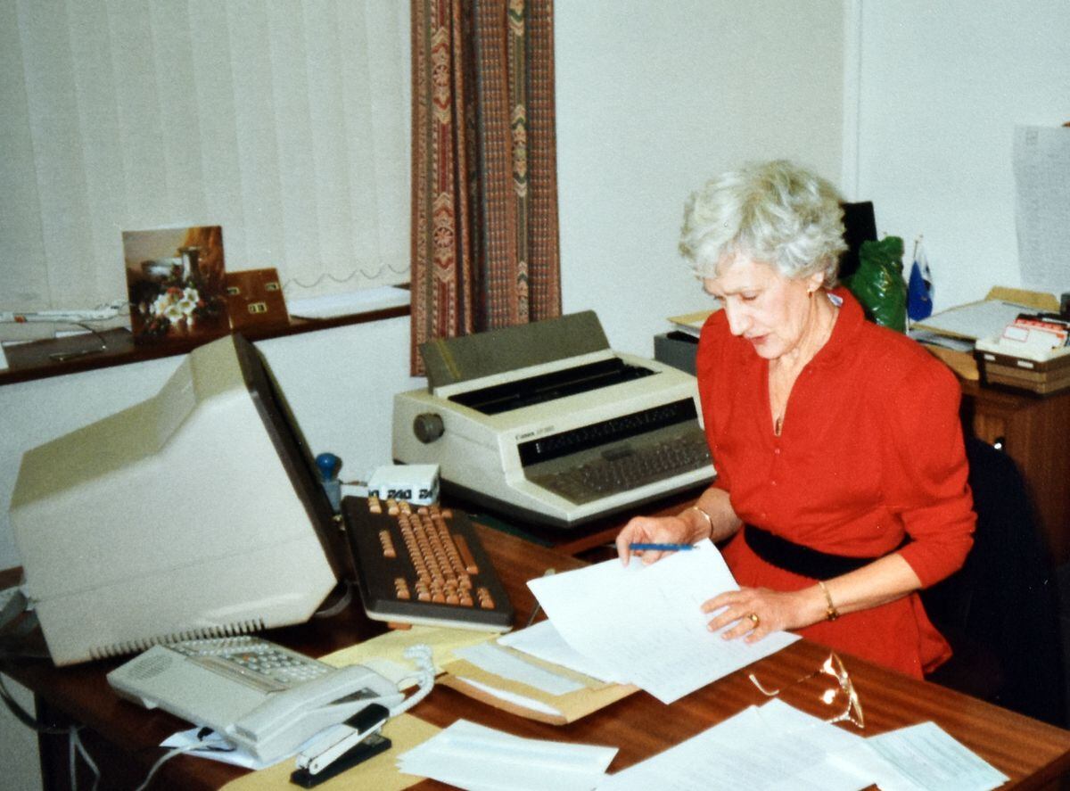 At her desk at Stadco, December 1990.