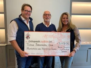 Members of the Llanforda and Three Valleys shoot present the cheque to the institute