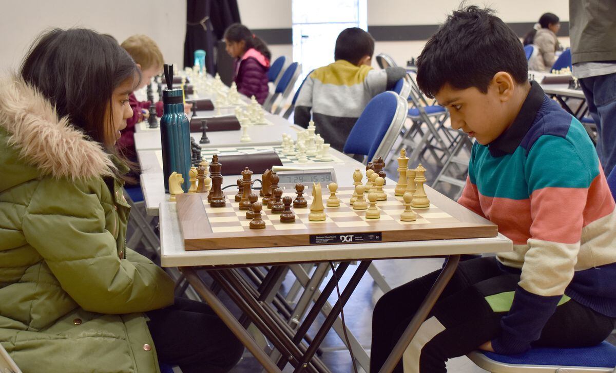 Samay Kaul of Mayfield Prep School, Walsall, playing with the white pieces, takes on Anvikkashri Prabhakaran of Leamington Spa in the under-eights section. They fought all the way until only the kings were left – a draw.