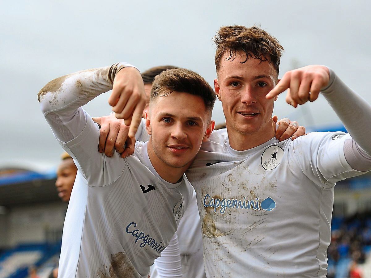Ryan Sears of Telford (on loan from Shrewsbury Town) and Ryan Barnett of Telford (on loan from Shrewsbury Town) celebrate after Sears scores to make it 1-0  during the Vanarama Conference North fixture between AFC Telford United and Kettering at The New Bucks Head on Saturday, March 14, 2020.