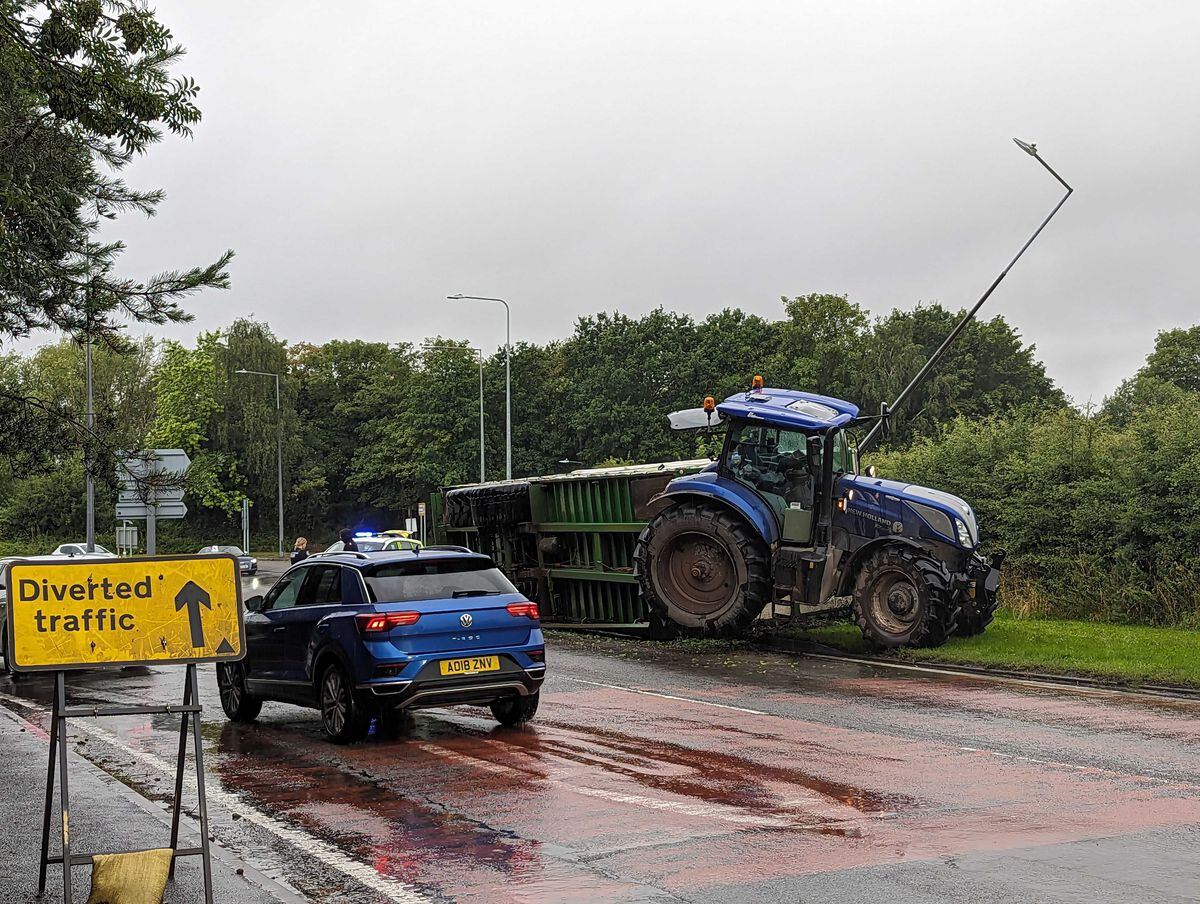 The tractor and overturned trailer