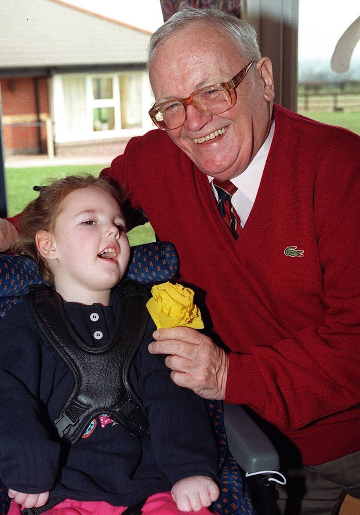 Sir Harry Secombe pictured during his Valentine's Day visit in 1998 with Shannon Trow, aged six, from Shrewsbury.