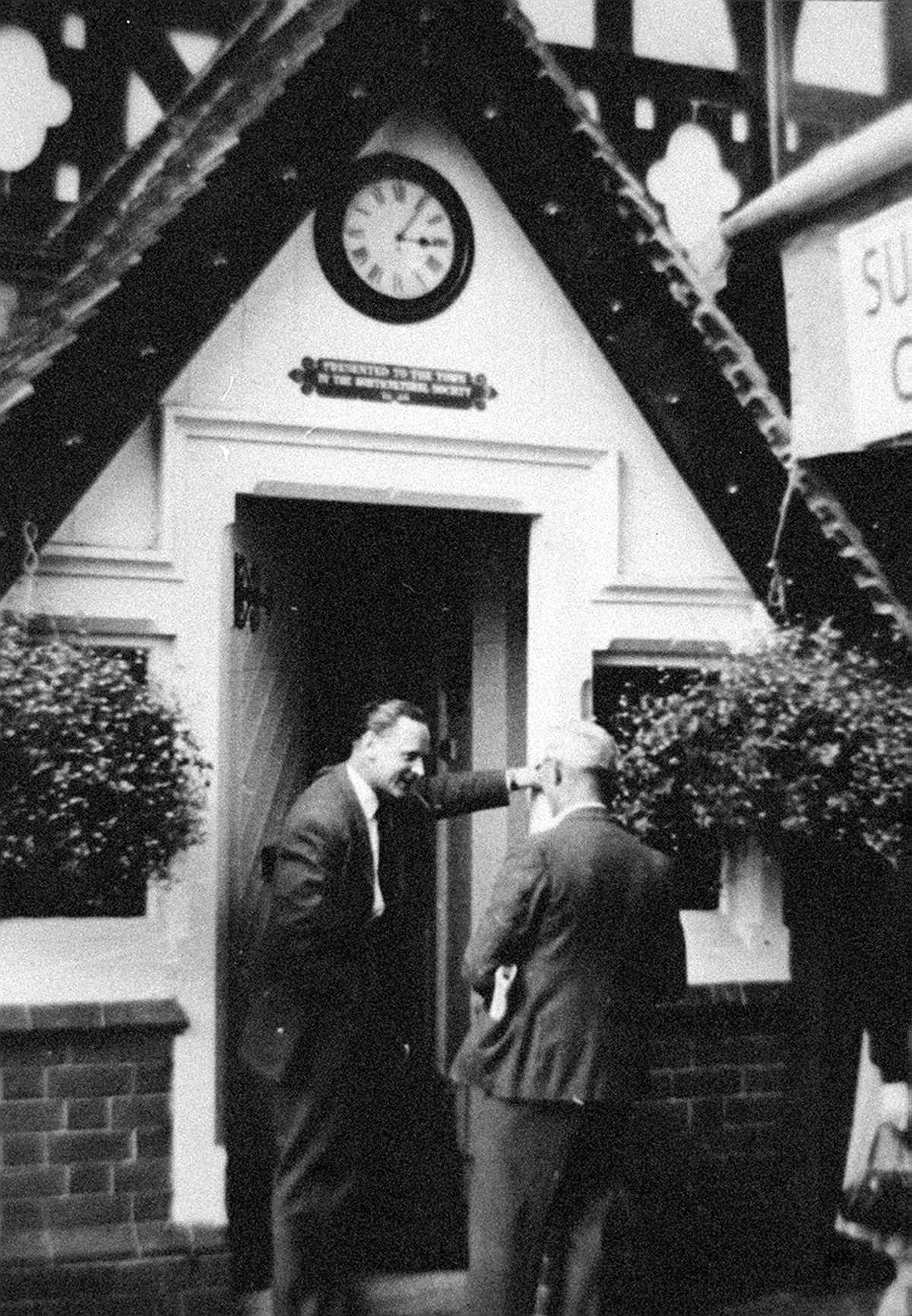 Chatting outside his home at Quarry Lodge in the 1950s.