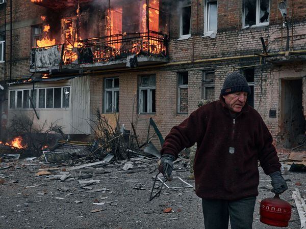 A local resident leaves his home after Russian shelling destroyed an apartment house in Bakhmut, Donetsk region, Ukraine
