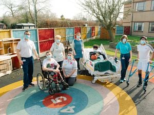 Alice Ward staff and patients in the current garden. From left - right: Jack Titley, Logan Sellers, Jean Blakemore, Shannon Bate, Helen Portman, Zephaniah Mantack-Millwood, Ann Smith and Mohammed Sufyan.