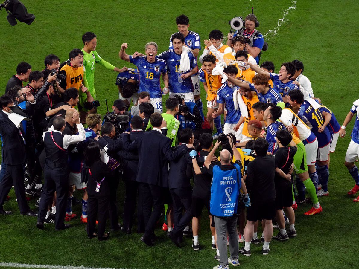 Japan players celebrate after the FIFA World Cup Group E match at the Khalifa International Stadium, Doha, Qatar. Picture date: Wednesday November 23, 2022.