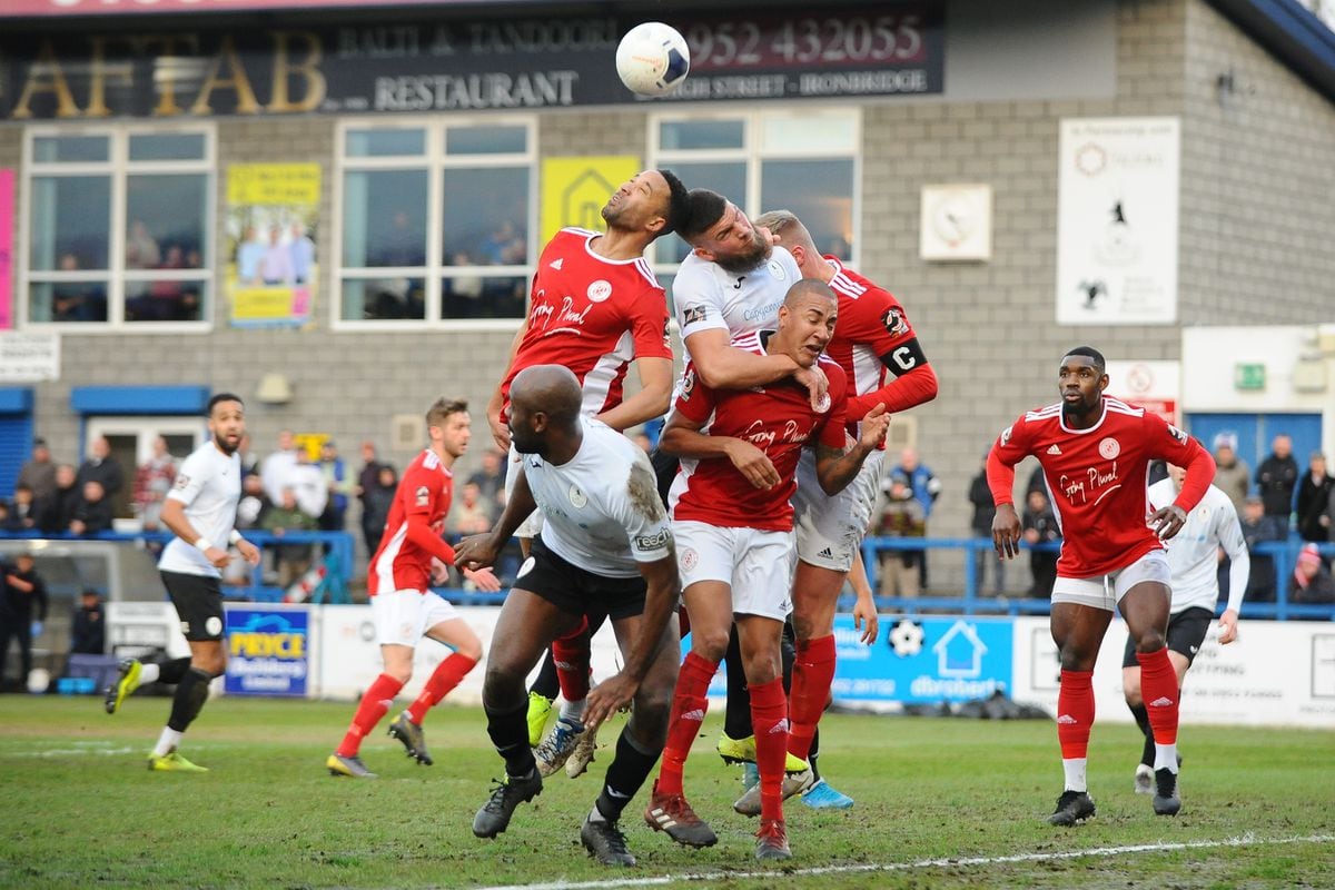Shane Sutton of Telford battles for a header in a crowded penalty area (Mike Sheridan/Ultrapress)
