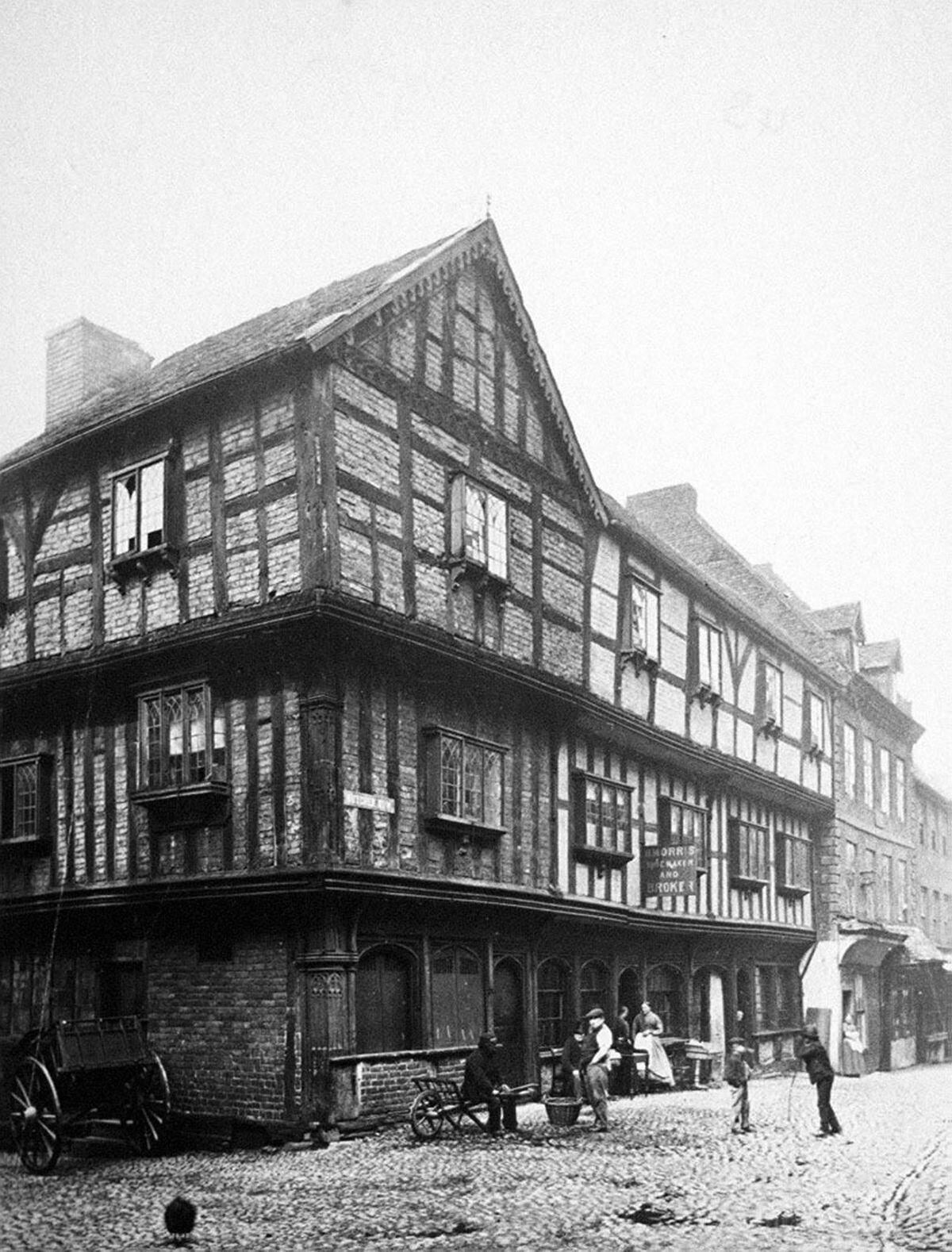A very early photograph of a distinctive building on the corner of Butcher Row and Fish Street, possibly from the late Victorian era