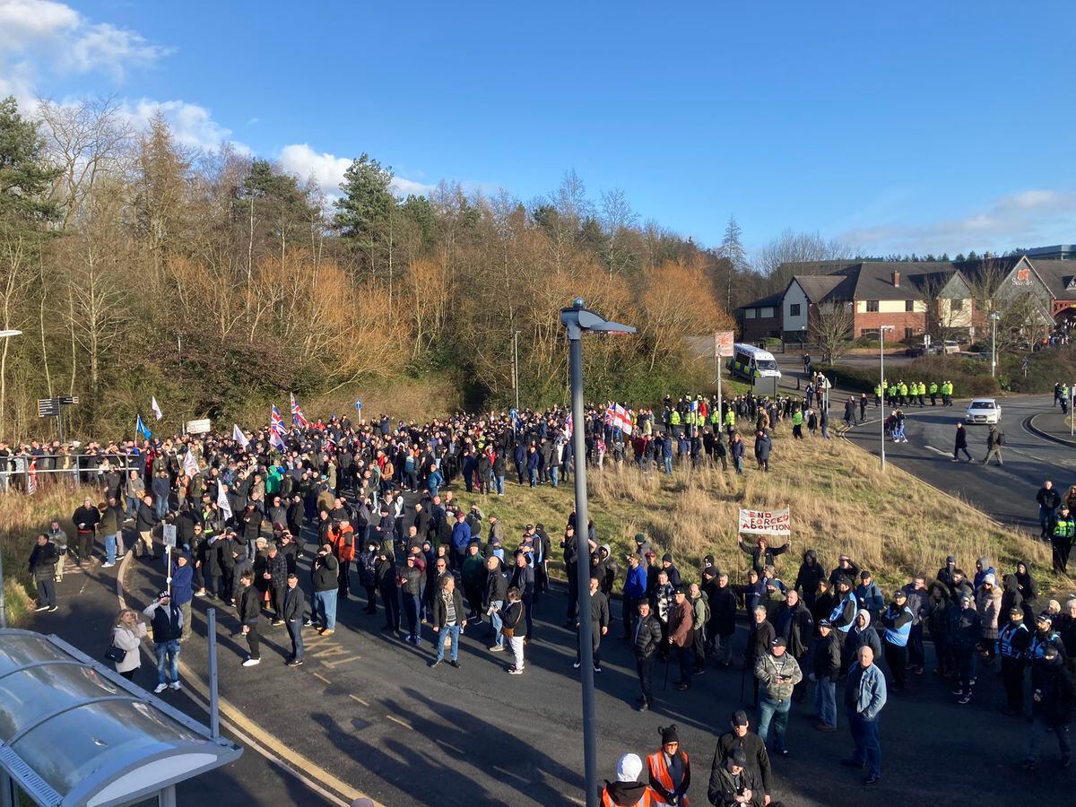 The Tommy Robinson march leaves Telford Railway Station 