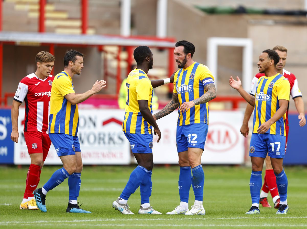 Dan Udoh of Shrewsbury Town celebrates with his team mates after scoring a goal to make it 0-1. (AMA)