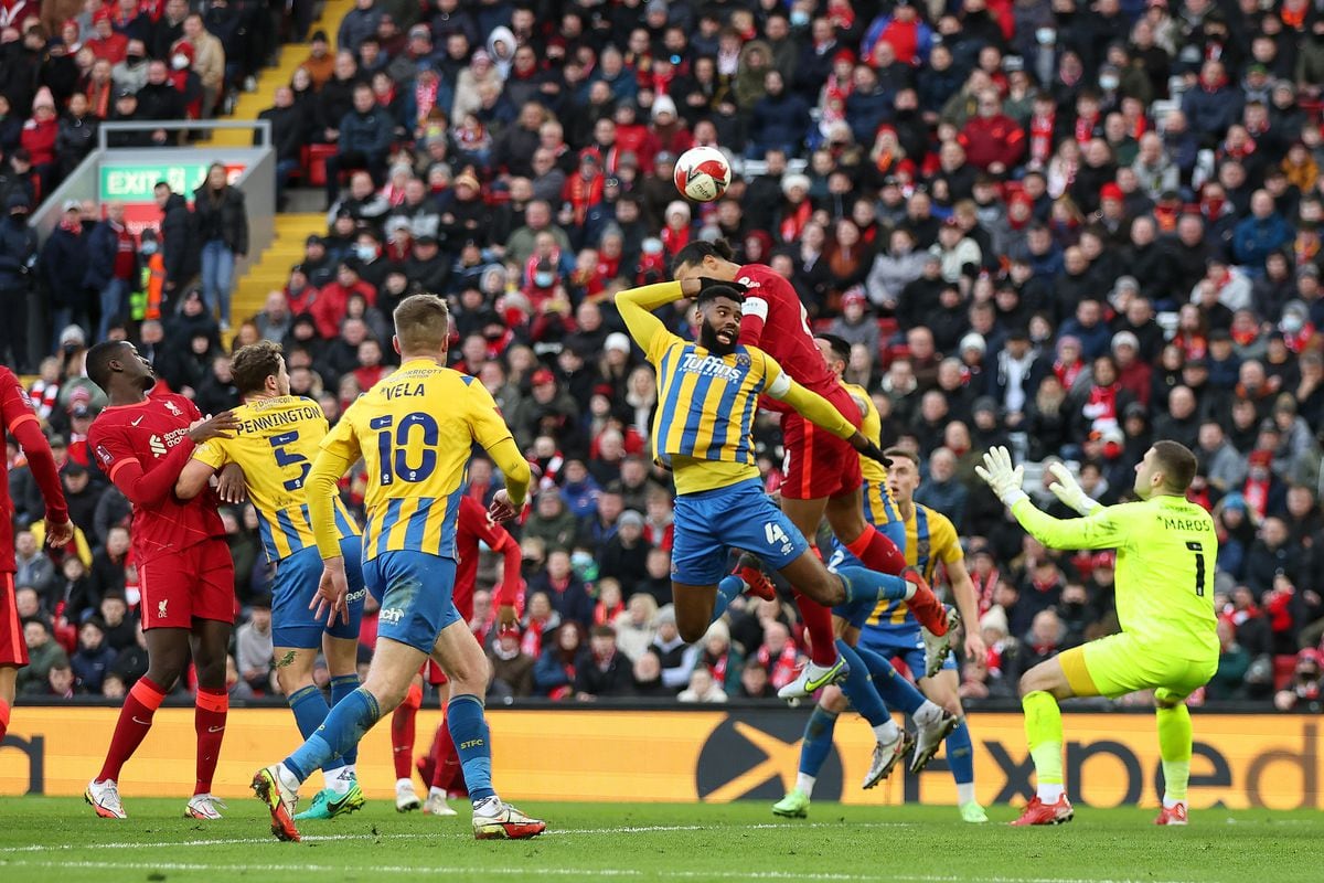 Ethan Ebanks-Landell of Shrewsbury Town handles the ball under pressure from Virgil van Dijk of Liverpool which results in a penalty to make it 2-1 to Liverpool (AMA)
