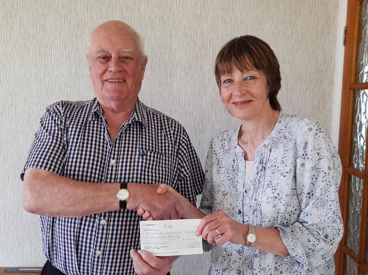 Phil Jones of MCCP presents a grant to Helen Hayes of Montgomery Church for the Tea and Talk project