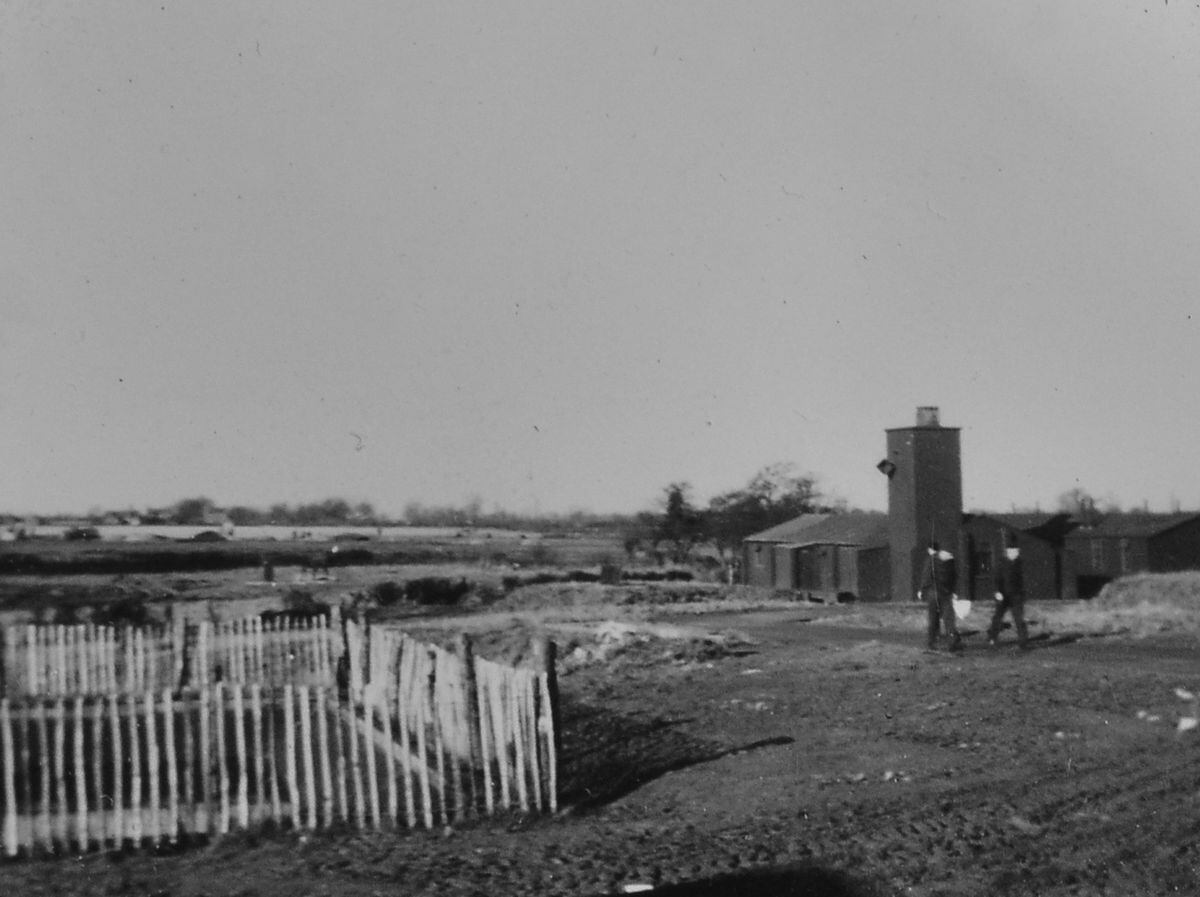 A rare wartime shot, showing the ablutions and static water tank.